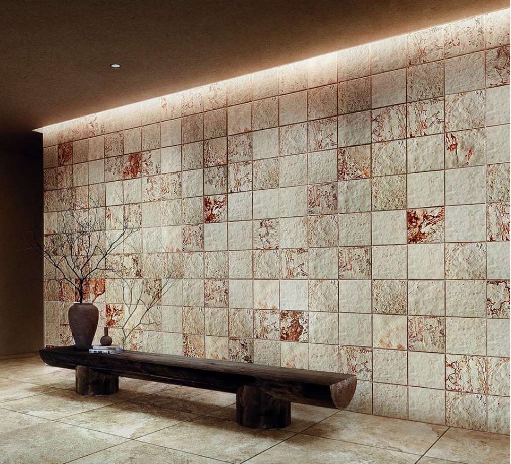 Concept interior with a tiled decorative feature wall, a dark bench and warm grazing light