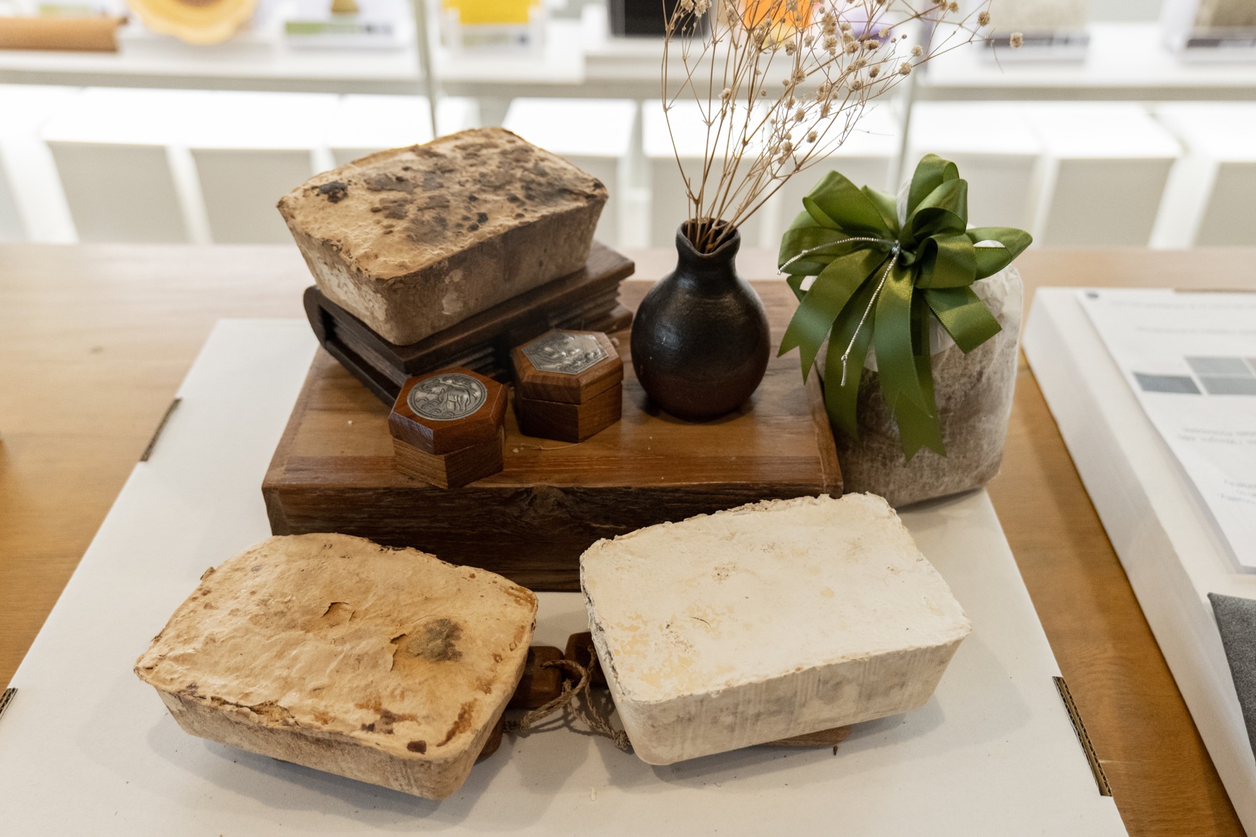 MUSH material display with pale samples, a composite vessel, timber and dried stems